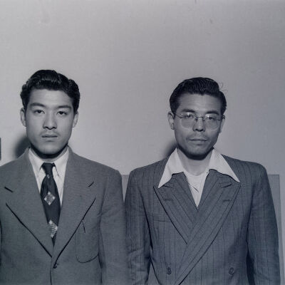 Two Japanese civilian men wearing dress suits