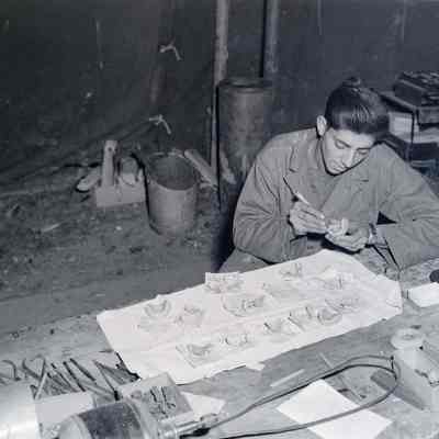 Soldier making dental plates