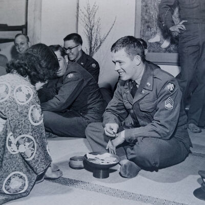 Soldier being served by a Japanese hostess in a restaurant