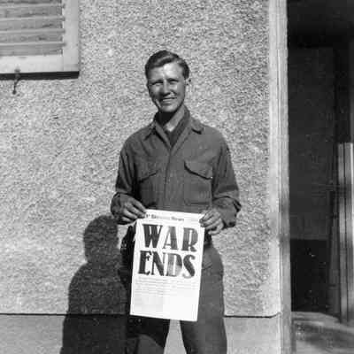 Soldier holding newspaper