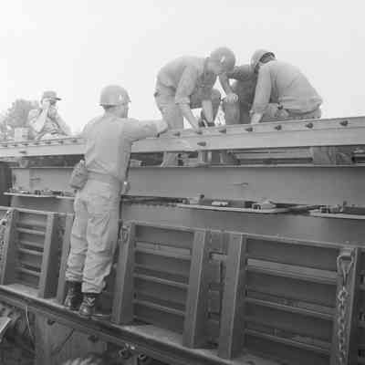 Soldiers training to construct a pontoon bridge