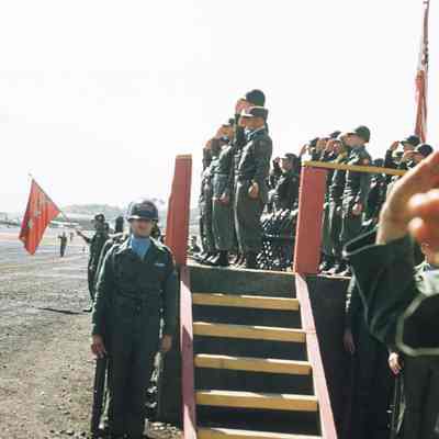 Soldiers saluting on podium