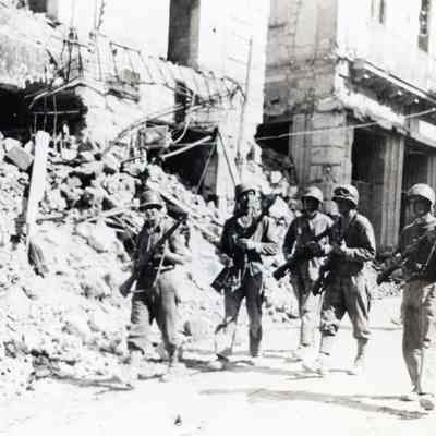 Soldiers Marching through Rubble
