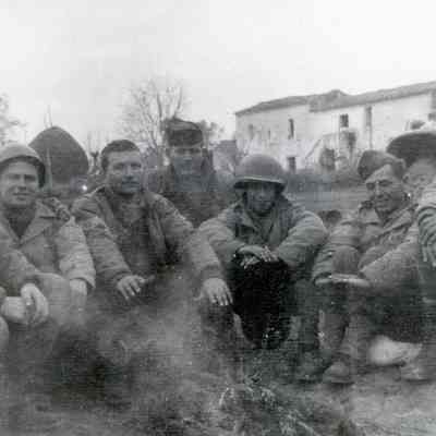 Soldiers huddled around a fire