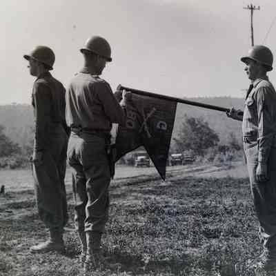 General Eagles pinning streamer on guidon