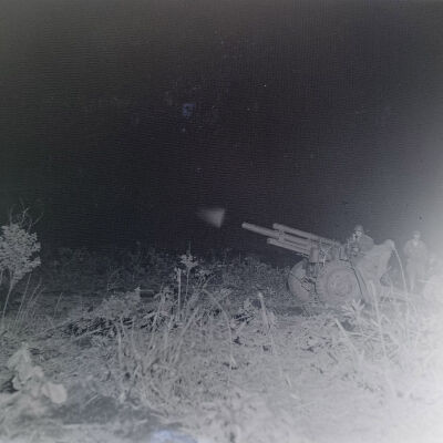 Soldiers firing a 105mm gun