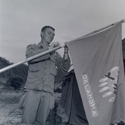 Soldier displaying Oklahoma flag