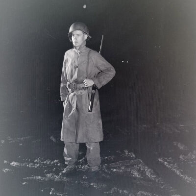 Night photo of a soldier on guard duty