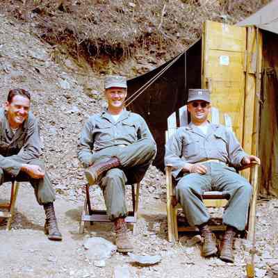 Soldiers relaxing in front of tent