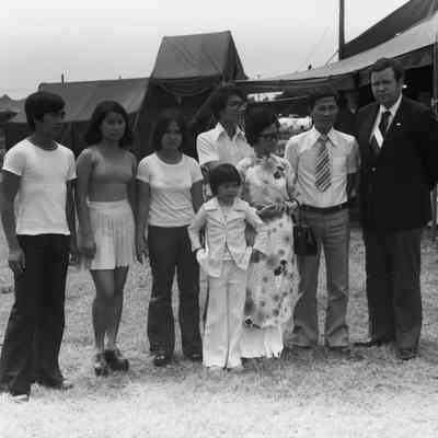 Govenor David Boren meeting a refugee family from Vietnam