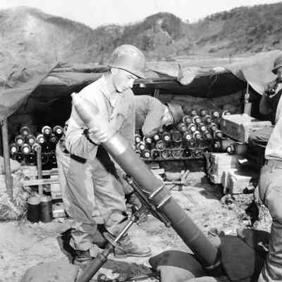 Soldier loading Mortar