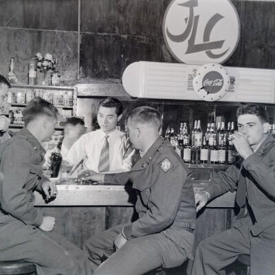 Group of soldiers drinking at a bar