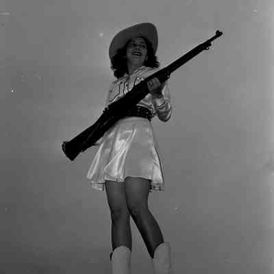 Girl posing with rifle