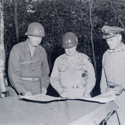 General Styron and other officers examining a map