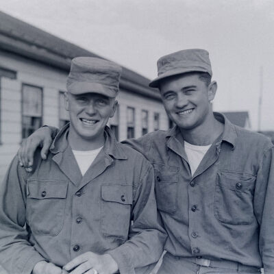 Two soldiers posing for picture