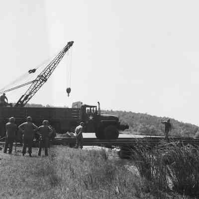 Truck driving on pontoon bridge section