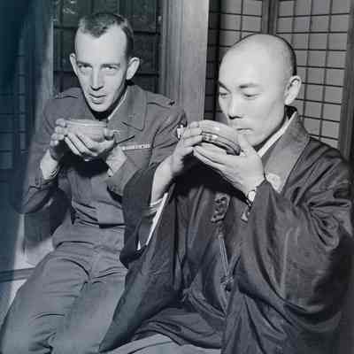 Soldier drinking tea with a Japanese man