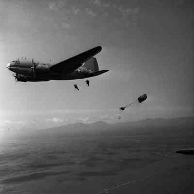 Paratroopers jumping from a C-46