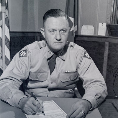 General Styron posed at his desk