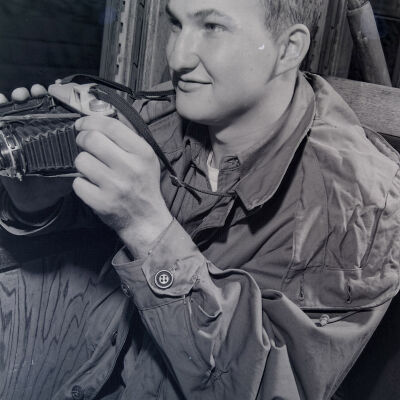 Soldier holding a camera