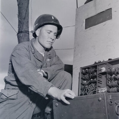 Officer inspecting communication equipment