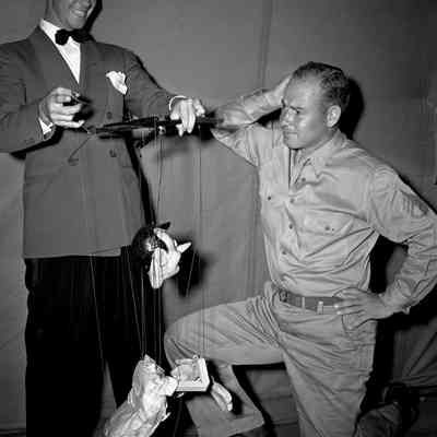 Puppeteer performing for a soldier