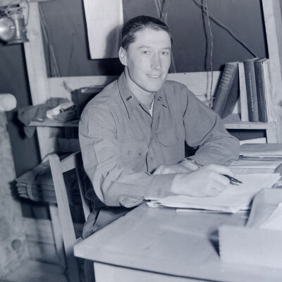 A Lieutenant sitting at a field desk