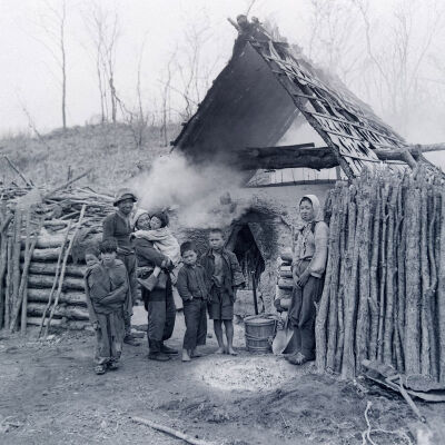 Family in a makeshift dwelling