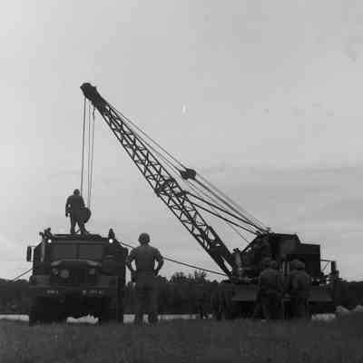 Soldiers training to construct a pontoon bridge