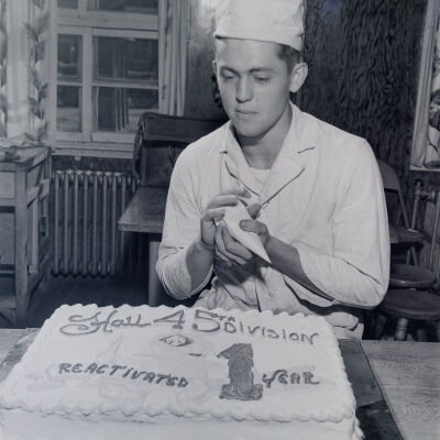 Cook with a cake celebrating 45th Division one year of reactivation