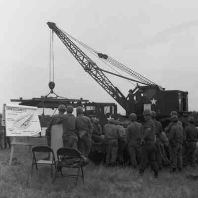 Soldiers training to construct a pontoon bridge