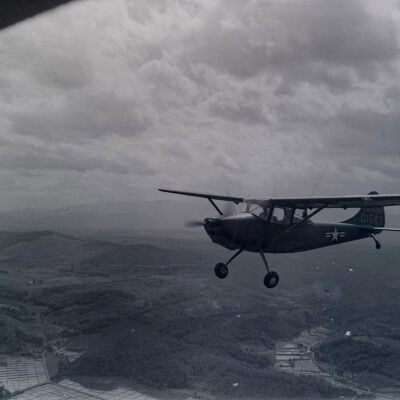 Light observation aircraft in flight