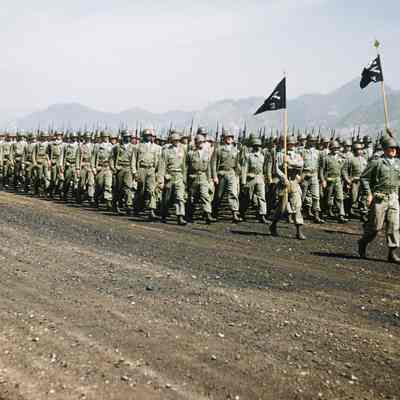 Soldiers marching during a review