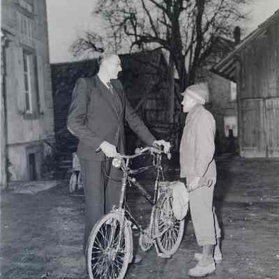 Soldier talking with tall civilian