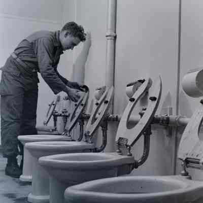 Soldier replacing toilet paper