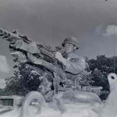 Tank crewman manning 50-caliber machine gun