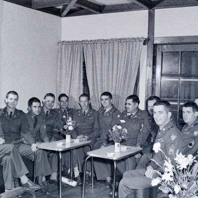 A group of soldiers in a meeting room