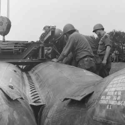 Soldiers training to construct a pontoon bridge