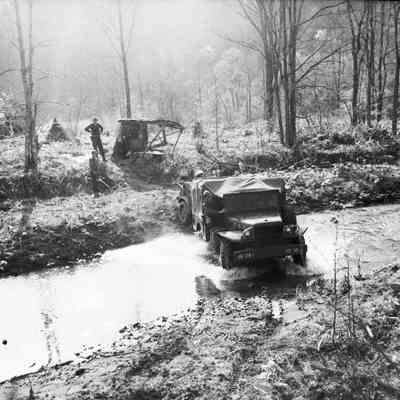 Trucks crossing stream