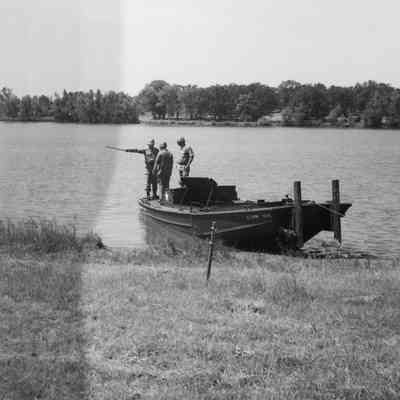 Soldiers on construction boat