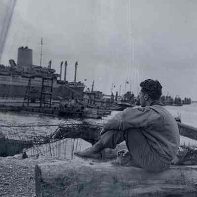 Soldier sitting near dock