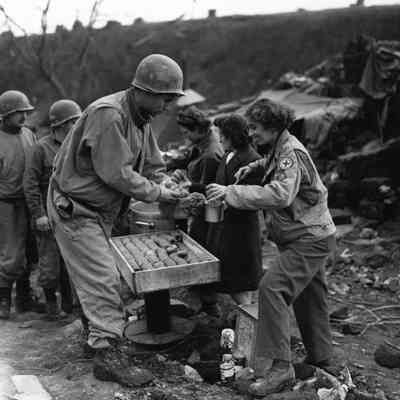 Donut Dollies serving food to Soldiers