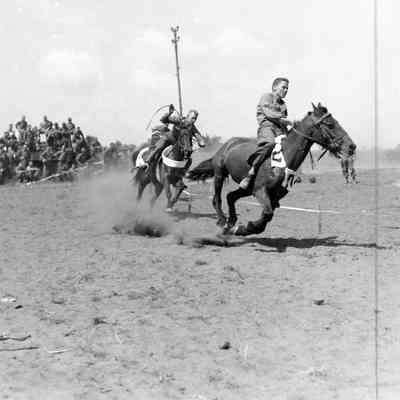 Soldiers racing horses