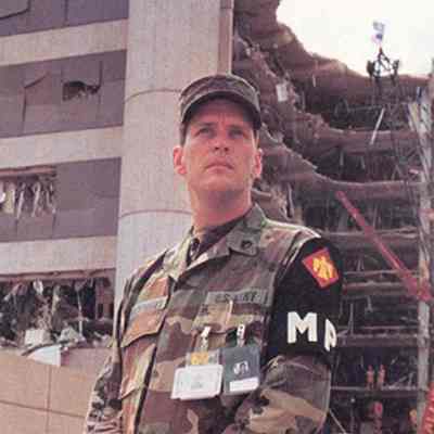 Soldier standing in front of Murrah Building