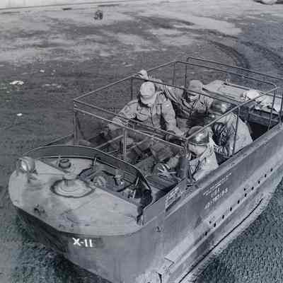 Soldiers sitting in an amphibious tracked vehicle