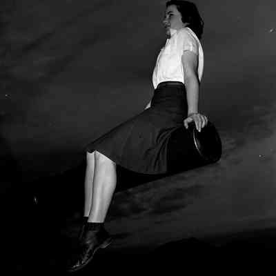 Girl sitting on the barrel of an artillery piece