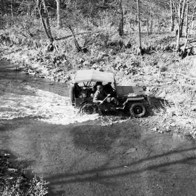Jeep fording a stream