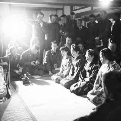 Soldiers and Japanese civilians at a tea ceremony
