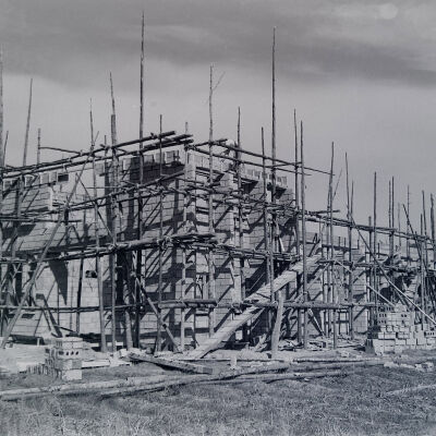 Masonry building under construction using timber scaffolding