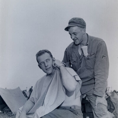Soldier getting an outdoor haircut